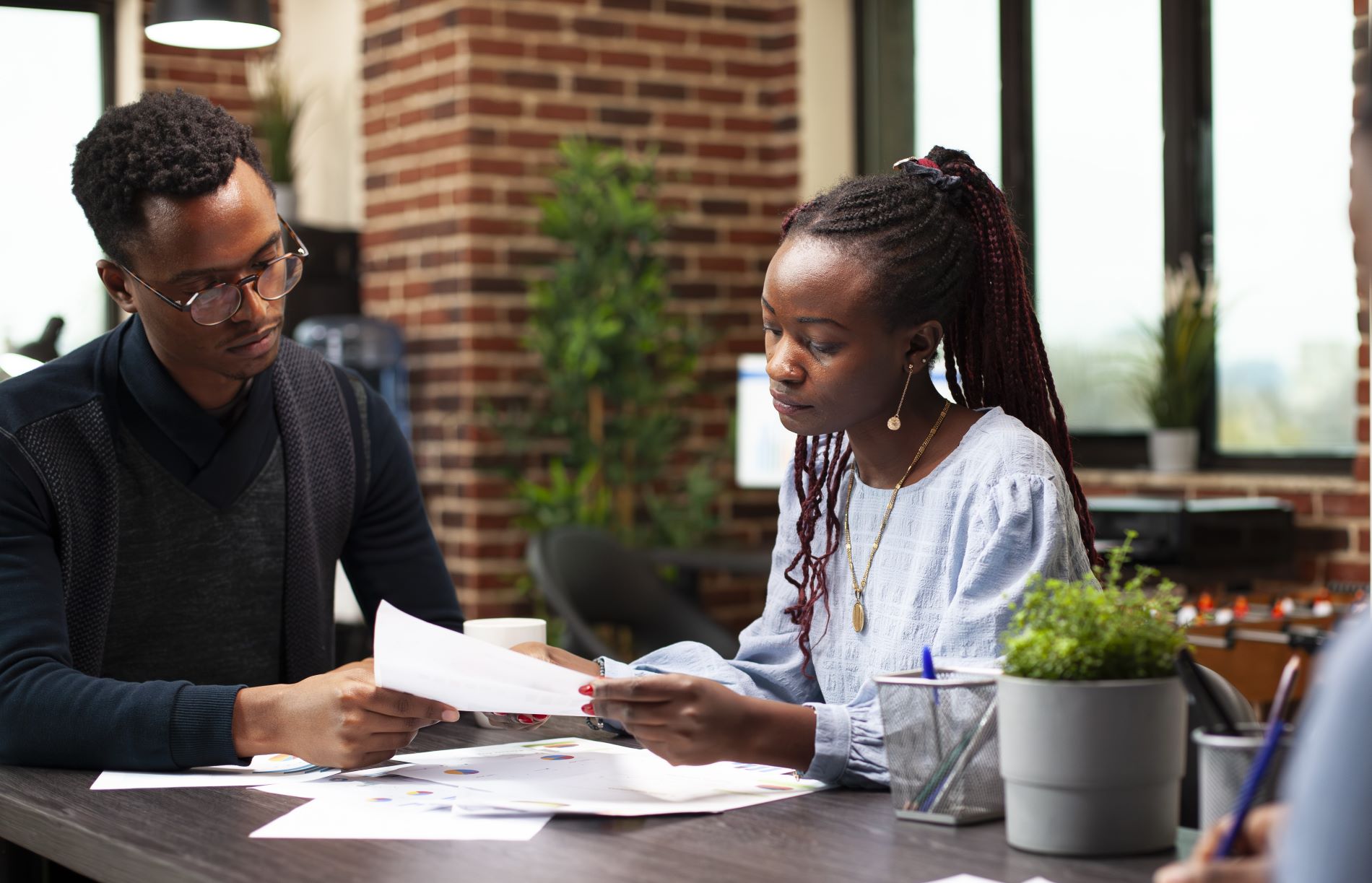 alcyon-colleagues-reading-documents-office